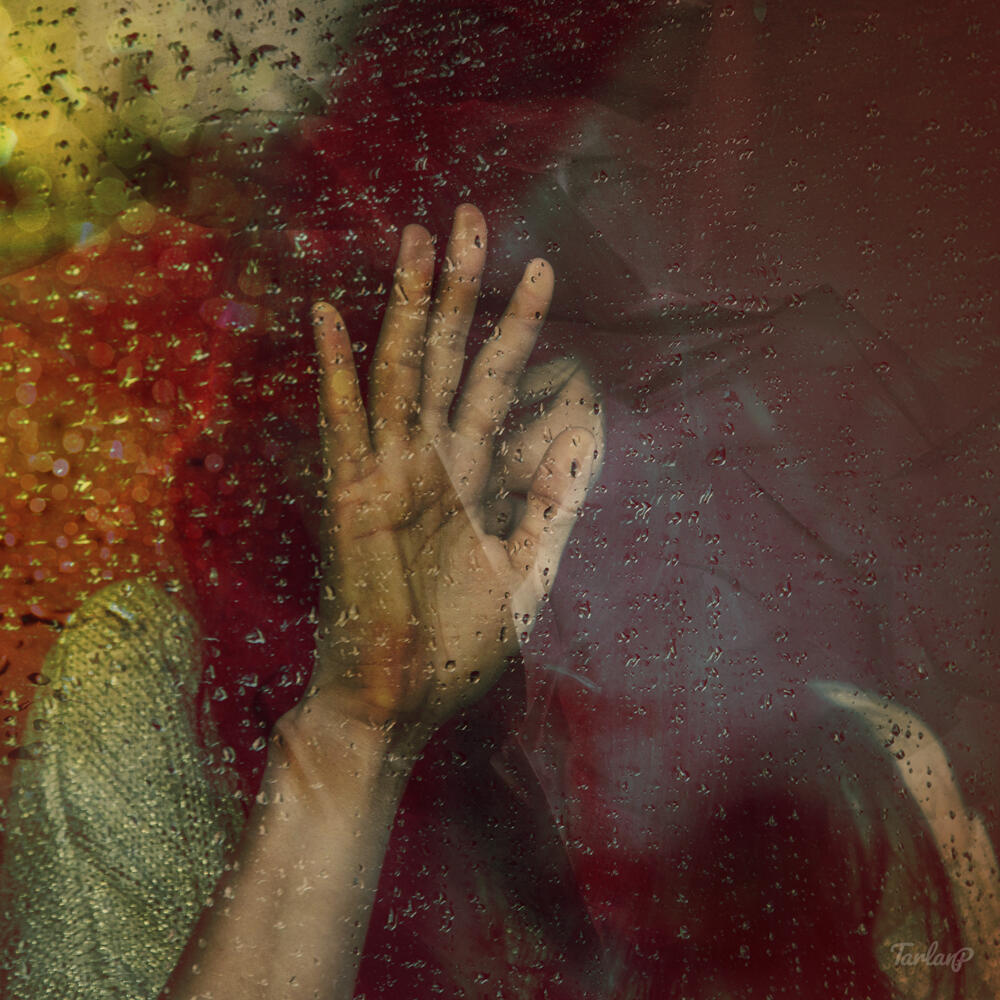 Girl Behind the Rainy Window